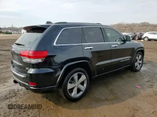 2016 Jeep Grand Cherokee Overland with VIN 1C4RJFCG8GC402339, listed as a Copart auction lot 47553385 with 121,486 mi miles and Salvage title. Bid and sale history available at DreamBid. Image 14.