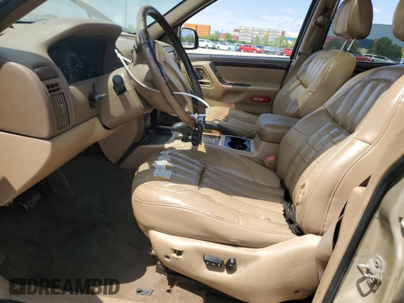 2000 Jeep Grand Cherokee Limited z VIN 1J4GW58N0YC272532, wystawiony jako Copart lot #57524225 z przebiegiem 238 921 mil mil oraz Szkoda całkowita • Salvage title. Historia ofert i sprzedaży dostępna na DreamBid. Obrazek 7.