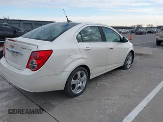 2014 Chevrolet Sonic LTZ with VIN 1G1JE5SH3E4133088, listed as a IAAI auction lot 41072056 with 143,855 mi miles. Bid and sale history available at carsss.com. Image 4.
