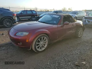 2007 Mazda MX-5 Miata Sport z VIN JM1NC25F970124896, wystawiony jako Copart lot #83624394 z przebiegiem 62 735 mil mil oraz Szkoda całkowita • Salvage title. Historia ofert i sprzedaży dostępna na DreamBid. Obrazek 1.