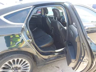 2014 Ford Fusion Titanium Hybrid with VIN 3FA6P0RU9ER111834, listed as a IAAI auction lot 41570337 with 121,099 mi miles. Bid and sale history available at carsss.com. Image 8.