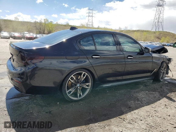 2018 BMW 5 Series M550i xDrive with VIN WBAJB9C55JB049384, listed as a Copart auction lot 54934435 with 79,061 mi miles and Non Repairable. Bid and sale history available at DreamBid. Image 3.
