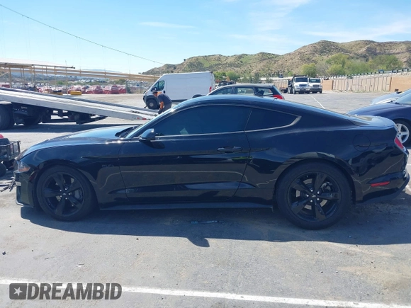 2021 Ford Mustang GT z VIN 1FA6P8CF4M5149580, wystawiony jako IAAI lot #41878355 z przebiegiem 60 028 mil mil oraz . Historia ofert i sprzedaży dostępna na DreamBid. Obrazek 14.