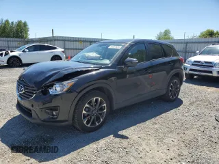 2016 Mazda CX-5 Grand Touring z VIN JM3KE4DY3G0822293, wystawiony jako Copart lot #59237825 z przebiegiem 45 114 mil mil oraz Czysty tytuł • Clean title. Historia ofert i sprzedaży dostępna na DreamBid. Obrazek 1.