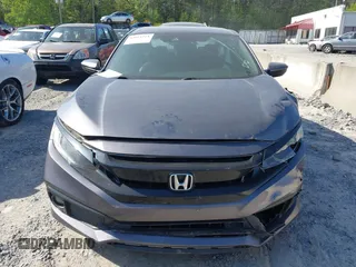 2019 Honda Civic Sport with VIN 2HGFC2F8XKH598141, listed as a IAAI auction lot 42013724 with 98,401 mi miles and . Bid and sale history available at DreamBid. Image 12.