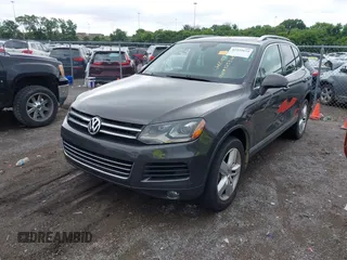 2012 Volkswagen Touareg Sport with VIN WVGFK9BP0CD002939, listed as a IAAI auction lot 42531654 with 222,435 mi miles and . Bid and sale history available at DreamBid. Image 2.