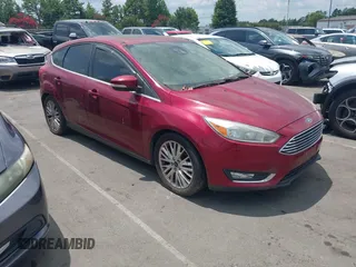 2015 Ford Focus Titanium z VIN 1FADP3N24FL217315, wystawiony jako IAAI lot #42750736 z przebiegiem 129 868 mil mil oraz . Historia ofert i sprzedaży dostępna na DreamBid. Obrazek 1.