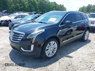 2018 Cadillac XT5 Premium Luxury AWD z VIN 1GYKNFRS3JZ112459, wystawiony jako IAAI lot #42590258 z przebiegiem 157 377 mil mil oraz . Historia ofert i sprzedaży dostępna na DreamBid. Obrazek 17.
