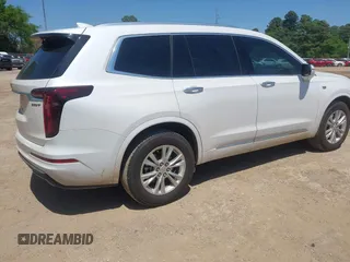 2024 Cadillac XT6 FWD Luxury z VIN 1GYKPAR49RZ739032, wystawiony jako IAAI lot #41985694 z przebiegiem 20 595 mil mil oraz . Historia ofert i sprzedaży dostępna na DreamBid. Obrazek 4.