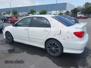 2004 Toyota Corolla CE with VIN JTDBR32E440052035, listed as a IAAI auction lot 42218301 with 299,999 mi miles. Bid and sale history available at carsss.com. Image 3.