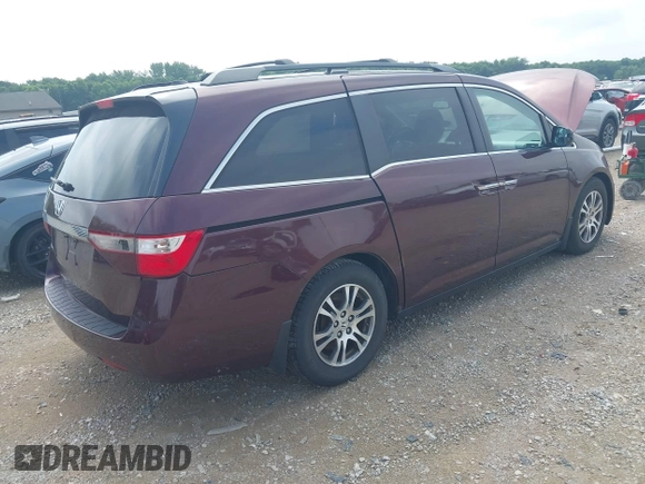 2011 Honda Odyssey EX-L with VIN 5FNRL5H6XBB096891, listed as a IAAI auction lot 42840531 with 214,842 mi miles and . Bid and sale history available at DreamBid. Image 4.