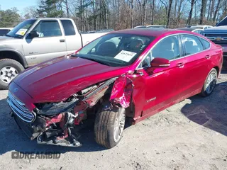 2014 Ford Fusion SE Hybrid with VIN 3FA6P0LU3ER251743, listed as a IAAI auction lot 41625631 with 136,355 mi miles. Bid and sale history available at carsss.com. Image 2.