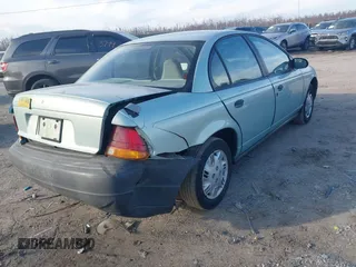 1997 Saturn SL with VIN 1G8ZH528XVZ196784, listed as a IAAI auction lot 41662187 with 112,278 mi miles. Bid and sale history available at carsss.com. Image 4.