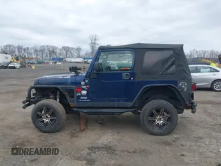 2004 Jeep Wrangler X with VIN 1J4FA39S64P780915, listed as a IAAI auction lot 42035524 with 131,057 mi miles. Bid and sale history available at carsss.com. Image 14.