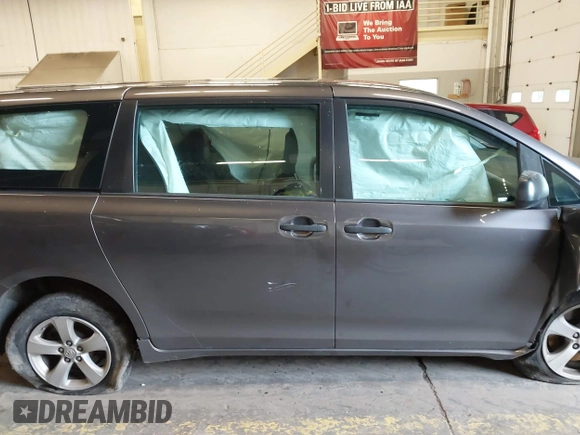 2015 Toyota Sienna L with VIN 5TDZK3DCXFS567507, listed as a IAAI auction lot 41205670 with 104,443 mi miles and . Bid and sale history available at DreamBid. Image 14.