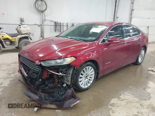 2013 Ford Fusion SE Hybrid with VIN 3FA6P0LU9DR150396, listed as a IAAI auction lot 42080329 with 195,665 mi miles. Bid and sale history available at carsss.com. Image 2.