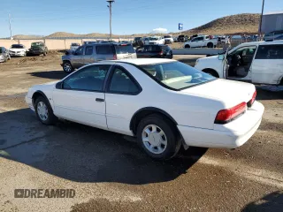 1994 Ford Thunderbird LX with VIN 1FALP62WXRH217279, listed as a Copart auction lot 80512504 with 176,798 mi miles and Salvage Title. Bid and sale history available at DreamBid. Image 2.