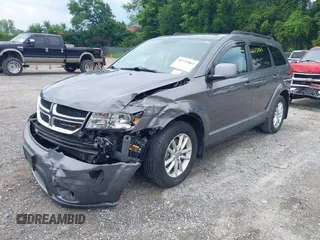 2013 Dodge Journey SXT with VIN 3C4PDCBG8DT517733, listed as a IAAI auction lot 42737063 with 67,363 mi miles and . Bid and sale history available at DreamBid. Image 2.
