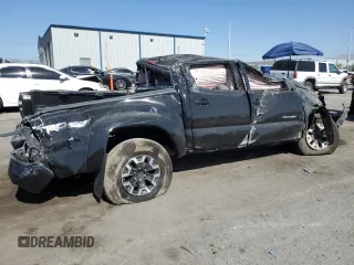 2014 Toyota Tacoma PreRunner with VIN 3TMJU4GN0EM170736, listed as a Copart auction lot 61993545 with 194,801 mi miles and Salvage title. Bid and sale history available at DreamBid. Image 3.