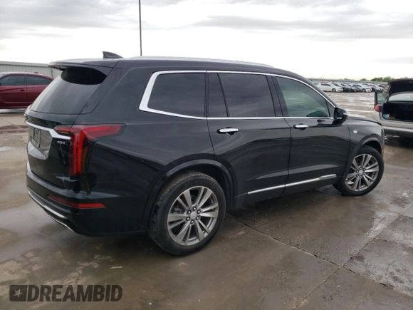 2023 Cadillac XT6 FWD Premium Luxury z VIN 1GYKPCRS5PZ101867, wystawiony jako Copart lot #51773545 z przebiegiem 31 322 mil mil oraz Szkoda całkowita • Salvage title. Historia ofert i sprzedaży dostępna na DreamBid. Obrazek 3.