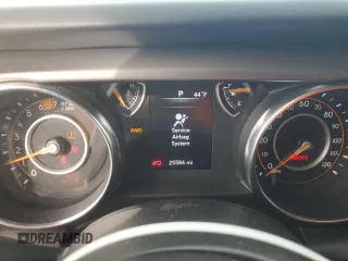 2023 Jeep Wrangler Sport S with VIN 1C4HJXDN5PW573692, listed as a Copart auction lot 42982875 with 25,584 mi miles and Salvage Title. Bid and sale history available at DreamBid. Image 9.