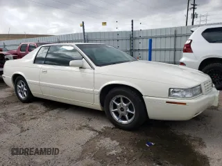 2002 Cadillac Eldorado z VIN 1G6EC12912B106675, wystawiony jako Copart lot #47630055 z przebiegiem 75 354 mil mil oraz Nie do naprawy • Non repairable. Historia ofert i sprzedaży dostępna na DreamBid. Obrazek 4.
