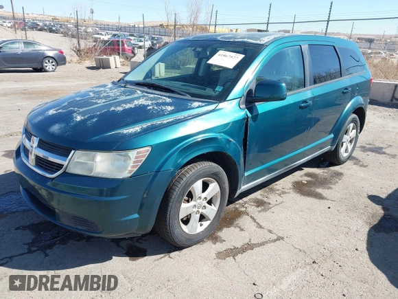 2009 Dodge Journey SXT with VIN 3D4GG57V09T170094, listed as a IAAI auction lot 41867577 with 122,831 mi miles. Bid and sale history available at carsss.com. Image 2.