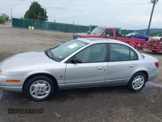 2002 Saturn SL z VIN 1G8ZK52762Z131497, wystawiony jako IAAI lot #42086108 z przebiegiem 119 273 mil mil oraz . Historia ofert i sprzedaży dostępna na DreamBid. Obrazek 14.