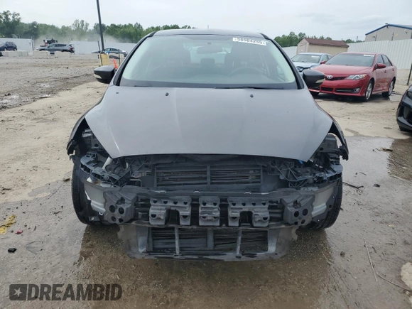 2017 Ford Focus SE с VIN 1FADP3F29HL267516, выставлен на аукционе Copart как лот 56984255 с пробегом 98 861 миль миль и Списание • Salvage title. История ставок и продаж доступна на DreamBid. Изображение 5.