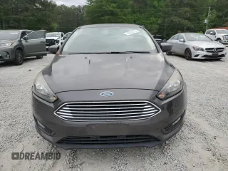 2018 Ford Focus SE z VIN 1FADP3FE1JL220741, wystawiony jako Copart lot #53755735 z przebiegiem Nie podano mil oraz Czysty tytuł • Clean title. Historia ofert i sprzedaży dostępna na DreamBid. Obrazek 5.