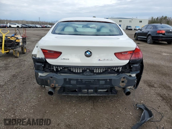 2015 BMW 6 Series 640i xDrive z VIN WBA6B8C56FD453175, wystawiony jako Copart lot #81372044 z przebiegiem 111 835 mil mil oraz Czysty tytuł • Clean title. Historia ofert i sprzedaży dostępna na DreamBid. Obrazek 6.