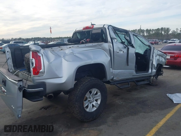 2016 GMC Canyon 2WD SLE with VIN 1GTG5CE34G1252553, listed as a IAAI auction lot 41609585 with 128,720 mi miles. Bid and sale history available at carsss.com. Image 4.