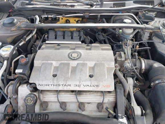 1999 Cadillac DeVille DHS z VIN 1G6KE54Y2XU752599, wystawiony jako IAAI lot #42141950 z przebiegiem 135 999 mil mil oraz . Historia ofert i sprzedaży dostępna na DreamBid. Obrazek 10.