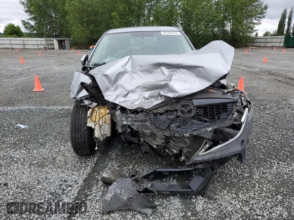 2014 Mazda CX-5 Touring z VIN JM3KE4CYXE0426408, wystawiony jako Copart lot #57355115 z przebiegiem Nie podano mil oraz Szkody całkowita. Historia ofert i sprzedaży dostępna na DreamBid. Obrazek 5.