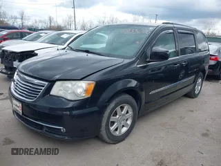 2013 Chrysler Town & Country Touring with VIN 2C4RC1BG5DR554662, listed as a IAAI auction lot 41833006 with 143,626 mi miles and . Bid and sale history available at DreamBid. Image 2.