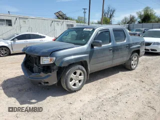 2013 Honda Ridgeline RTL with VIN 5FPYK1F51DB012680, listed as a Copart auction lot 50987085 with 63,372 mi miles and Salvage Title. Bid and sale history available at carsss.com. Image 1.