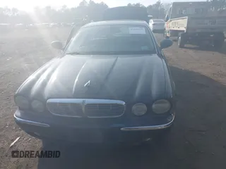 2004 Jaguar XJ with VIN SAJWA71C74SG22814, listed as a IAAI auction lot 41649399 with 114,841 mi miles. Bid and sale history available at carsss.com. Image 6.
