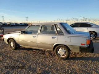 1986 Toyota Camry z VIN JT2SV12E9G0477991, wystawiony jako Copart lot #85531214 z przebiegiem 297 033 mil mil oraz Czysty tytuł • Clean title. Historia ofert i sprzedaży dostępna na DreamBid. Obrazek 2.