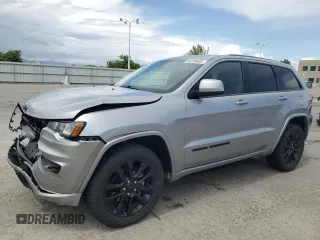 2018 Jeep Grand Cherokee Laredo E with VIN 1C4RJFAG0JC173200, listed as a Copart auction lot 55326805 with 127,489 mi miles and Salvage Title. Bid and sale history available at DreamBid. Image 1.