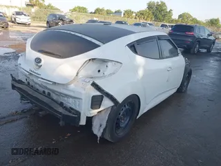 2017 Hyundai Veloster with VIN KMHTC6AD2HU312538, listed as a IAAI auction lot 42128452 with 1 mi miles. Bid and sale history available at carsss.com. Image 4.