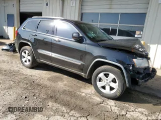 2012 Jeep Grand Cherokee Laredo with VIN 1C4RJEAG2CC215525, listed as a Copart auction lot 51876105 with 148,659 mi miles and Salvage Title. Bid and sale history available at carsss.com. Image 4.