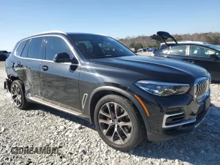 2023 BMW X5 sDrive40i with VIN 5UXCR4C06P9P01409, listed as a Copart auction lot 43127395 with 27,564 mi miles and Salvage Title. Bid and sale history available at carsss.com. Image 4.