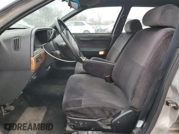 1991 Ford Taurus with VIN 1FACP52U9MG101093, listed as a Copart auction lot 45948105 with 594,696 mi miles and Salvage title. Bid and sale history available at DreamBid. Image 7.