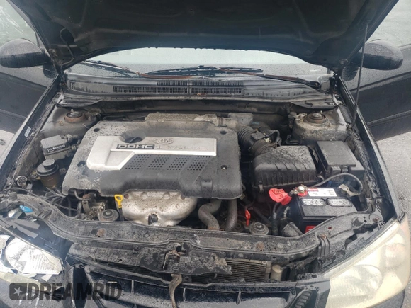 2005 Kia Spectra LX with VIN KNAFE121055134568, listed as a Copart auction lot 71541244 with 146,751 mi miles and Salvage Title. Bid and sale history available at carsss.com. Image 12.