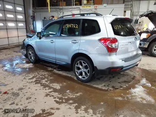 2015 Subaru Forester 2.5i Touring with VIN JF2SJAUCXFH471892, listed as a IAAI auction lot 41314722 with 94,717 mi miles. Bid and sale history available at carsss.com. Image 3.
