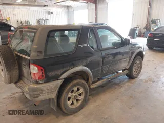 2002 Isuzu Rodeo z VIN 4S2CM57W124335034, wystawiony jako IAAI lot #42446556 z przebiegiem 214 718 mil mil oraz . Historia ofert i sprzedaży dostępna na DreamBid. Obrazek 4.