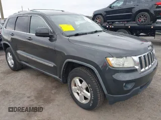 2011 Jeep Grand Cherokee Laredo with VIN 1J4RR4GG7BC670079, listed as a IAAI auction lot 41909702 with 167,375 mi miles. Bid and sale history available at carsss.com. Image 1.