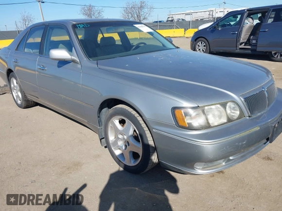 1999 Infiniti Q45 z VIN JNKBY31A8XM603290, wystawiony jako IAAI lot #41668113 z przebiegiem 144 251 mil mil oraz . Historia ofert i sprzedaży dostępna na DreamBid. Obrazek 1.