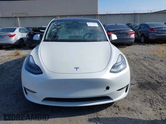 2024 Tesla Model Y with VIN 7SAYGDED2RF017448, listed as a IAAI auction lot 41597056 with 9,702 mi miles and . Bid and sale history available at DreamBid. Image 12.