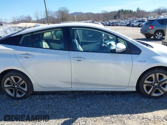 2021 Toyota Prius L Eco z VIN JTDKAMFUXM3142402, wystawiony jako IAAI lot #41665484 z przebiegiem 67 416 mil mil oraz . Historia ofert i sprzedaży dostępna na DreamBid. Obrazek 13.